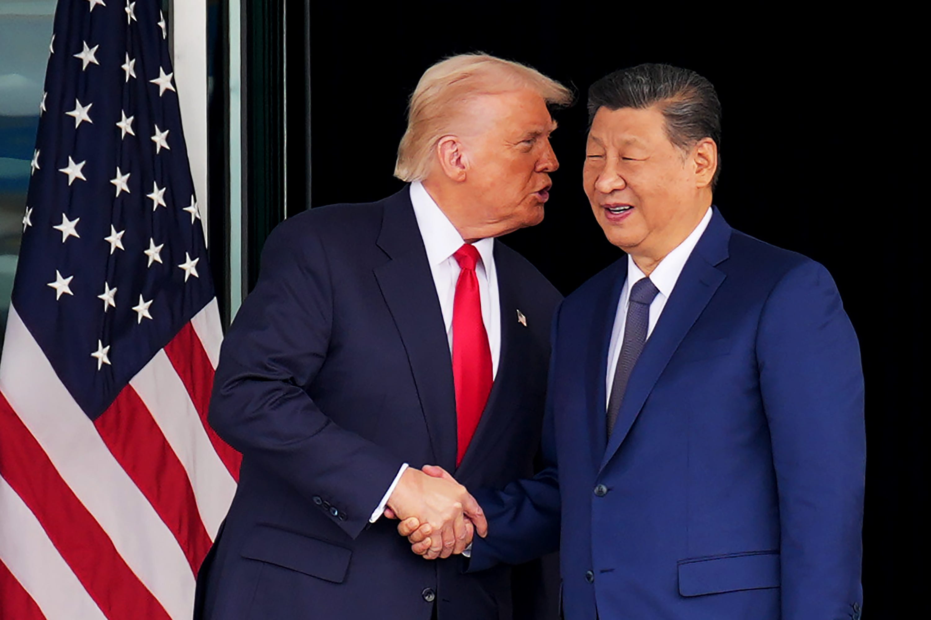 President Donald Trump and Chinese President Xi Jinping shake hands as they depart following a bilateral meeting at Gimhae Air Base on October 30, 2025 in Busan, South Korea.