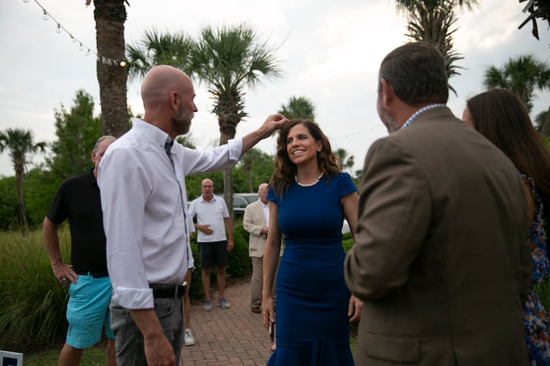 MT PLEASANT, SC - JUNE 14: Patrick Bryant adjusts the hair of his fiancé, Rep. Nancy Mace (R-SC) , during her event on the night of South Carolina's GOP primary elections on June 14, 2022 in Mt Pleasant, South Carolina. Maine, Nevada and North Dakota also held midterm primary elections on Tuesday. South Carolina races garnering national attention include Republican congressional contests between Katie Arrington and Rep. Nancy Mace and Rep. Tom Rice against Russell Frye.(Photo by Allison Joyce/Getty Images)