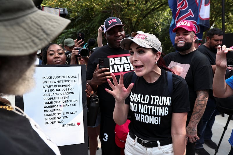 Laura Loomer argues with anti-Trump demonstrators in Atlanta, Georgia, on August 24, 2023.