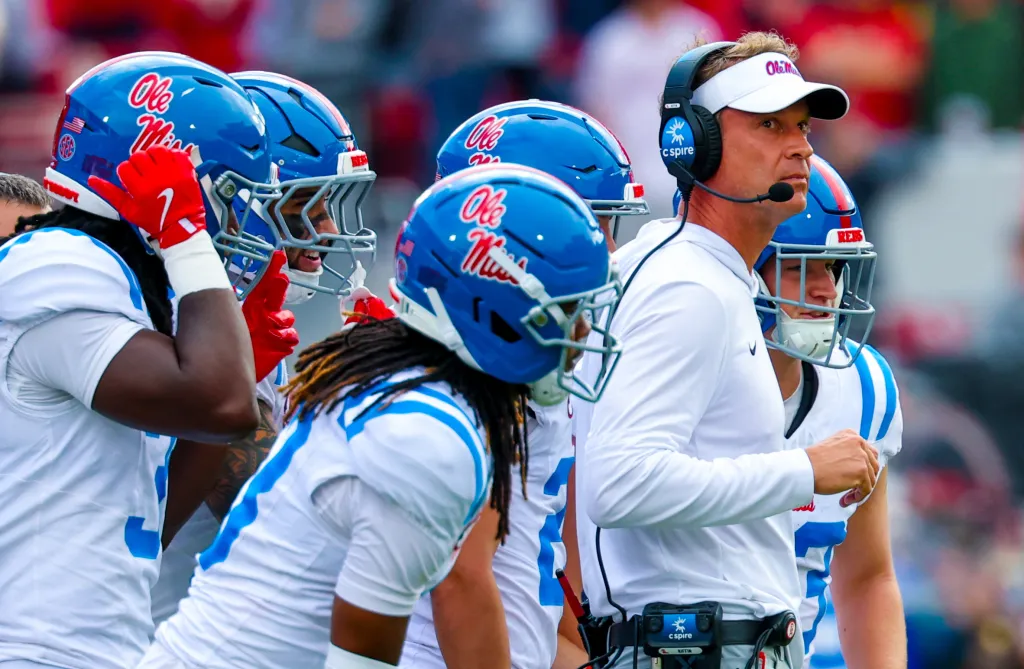Ole Miss Rebels head coach Lane Kiffin during a timeout with his players during the second half against the Oklahoma Sooners