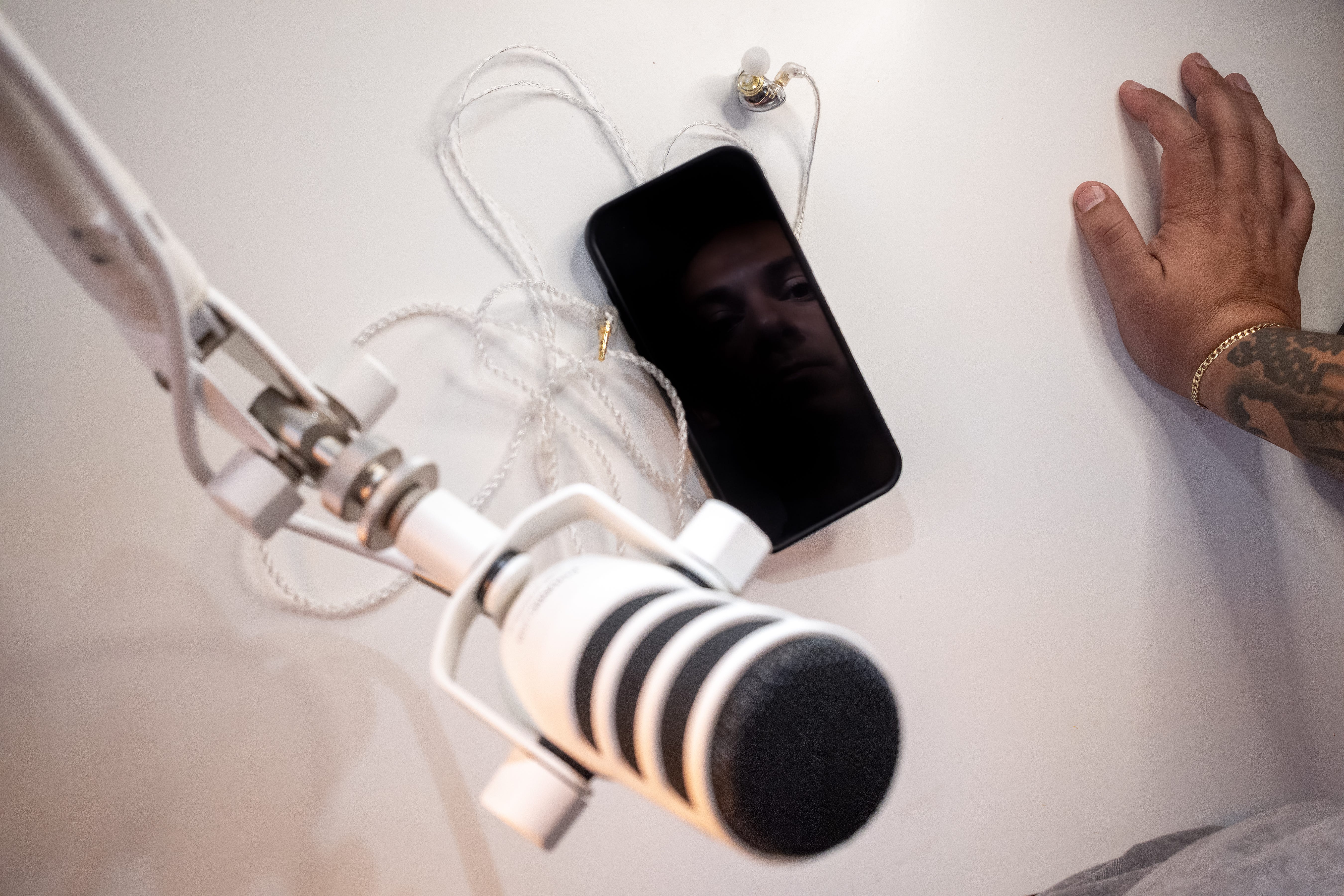 A dark phone beneath a microphone