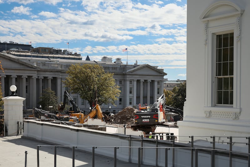Excavators work to clear debris after the East Wing of the White House was demolished