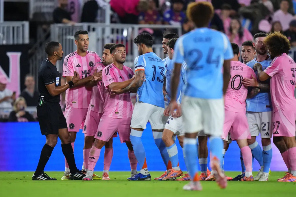 Referee Jon Freemon breaks up an altercation during NYCFC's season-ending loss to Inter Miami.
