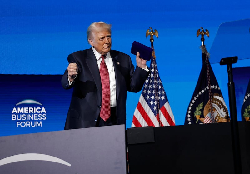 U.S. President Donald Trump dances after speaking at the America Business Forum at the Kaseya Center on November 05, 2025 in Miami, Florida. The forum brings together global leaders, cultural figures and innovators from various sectors for discussions on business, technology and social development.