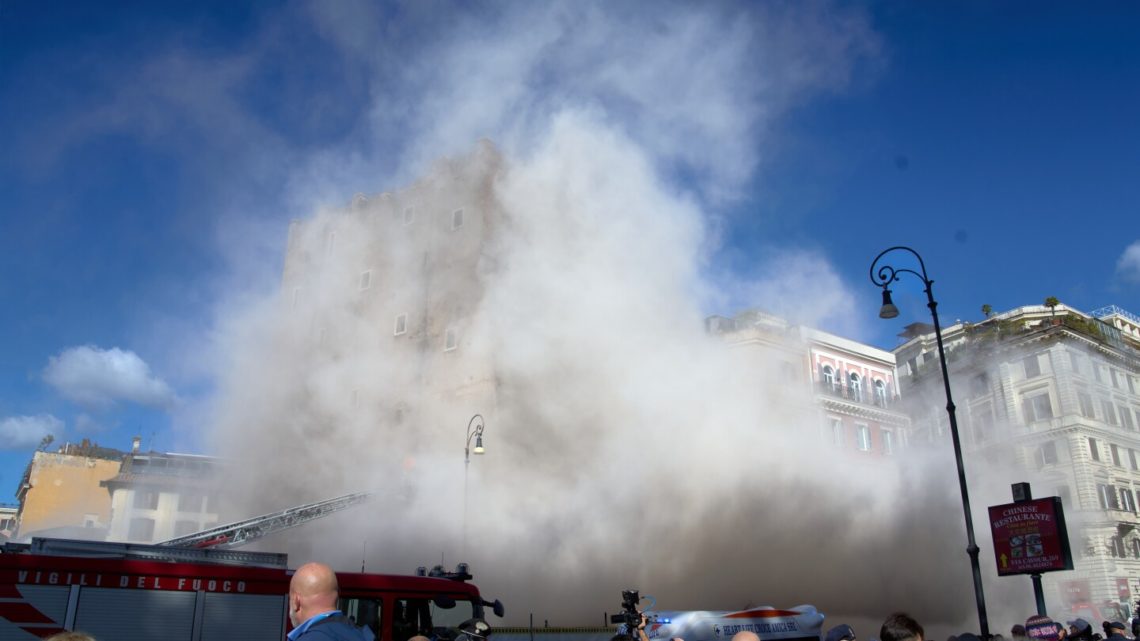 Rescuers work to reach worker trapped in medieval tower that partially collapsed in Rome
