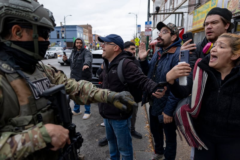Ald. Michael Rodriguez, 22nd, and a crowd confront Border Patrol agents as they detain a man along West 26th Street on Saturday, Nov. 8, 2025.