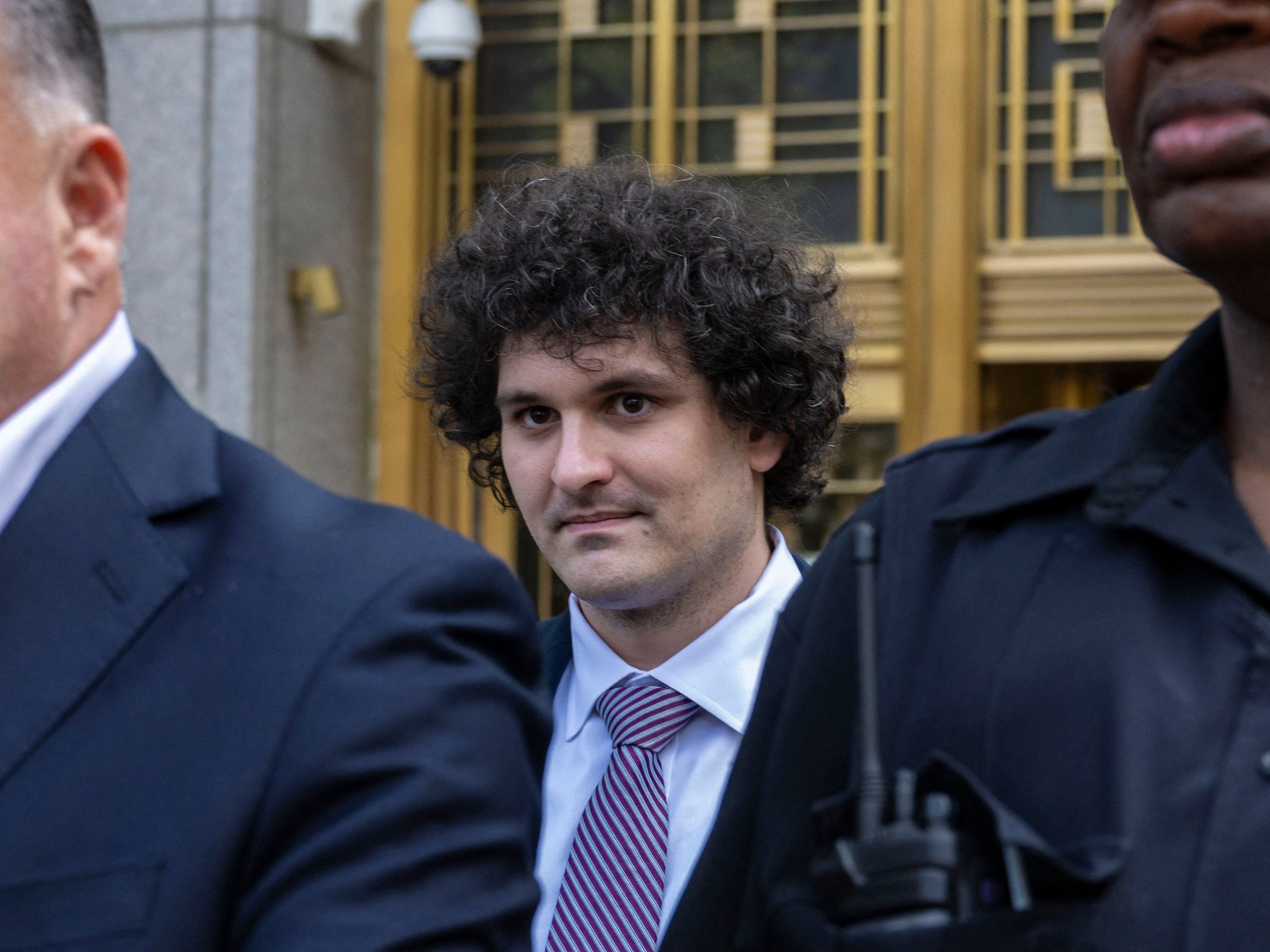 Former FTX chief Sam Bankman-Fried leaves the Federal Courthouse following a bail hearing ahead of his October trial, in New York City on July 26, 2023.