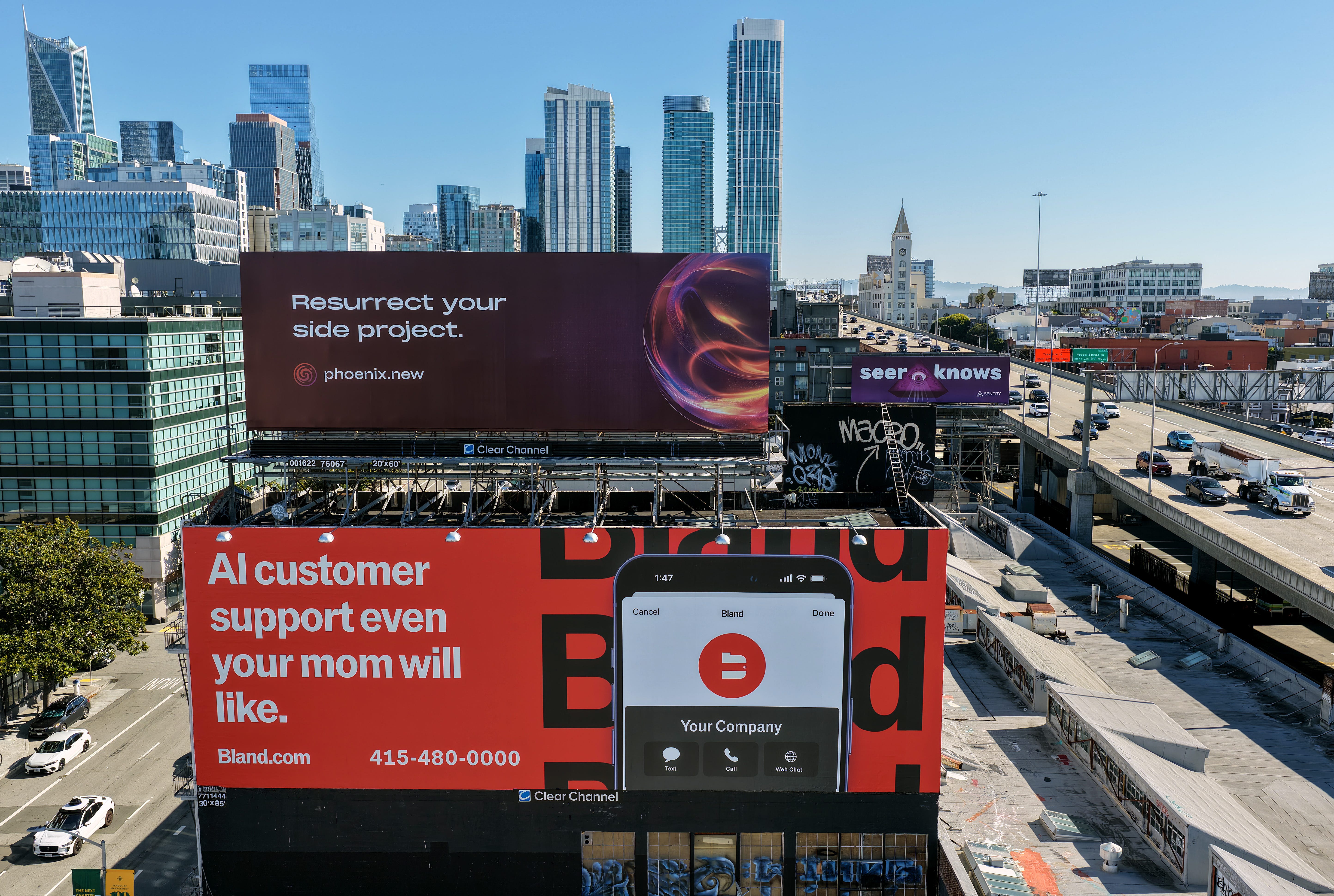 SAN FRANCISCO, CALIFORNIA - SEPTEMBER 16: In an aerial view, a billboard advertising an artificial intelligence (AI) company is posted on September 16, 2025 in San Francisco, California. As AI companies open offices in San Francisco, billboards advertising AI companies are appearing throughout the city and along Interstate 80.