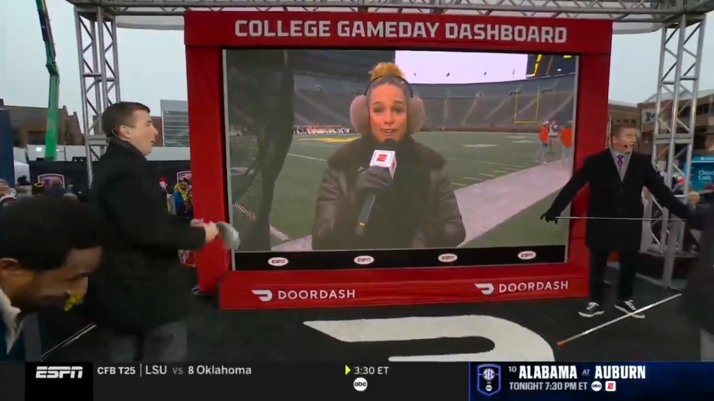 Jess Sims lets a NSFW comment slip on College GameDay while reporting in Michigan.