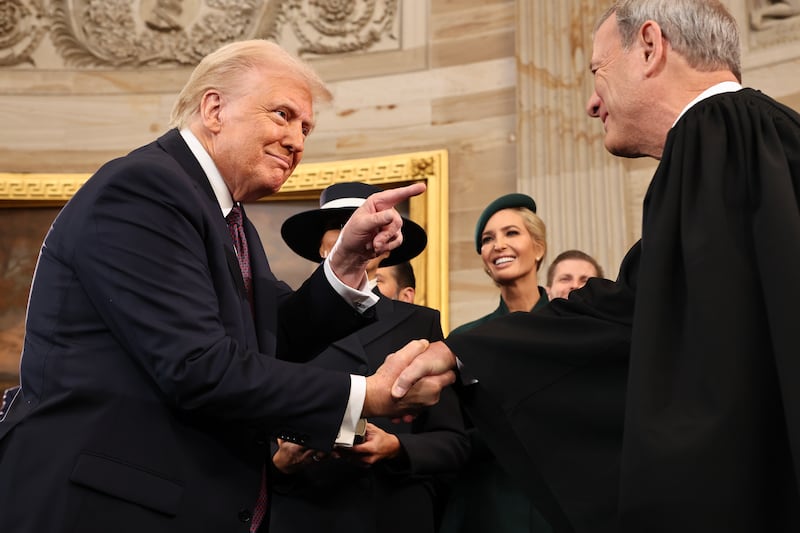 WASHINGTON, DC - JANUARY 20: U.S. President Donald Trump gestures to U.S. Supreme Court Chief Justice John Roberts after he was sworn in during inauguration ceremonies in the Rotunda of the U.S. Capitol on January 20, 2025 in Washington, DC. Donald Trump takes office for his second term as the 47th president of the United States. (Photo by Chip Somodevilla/Getty Images)