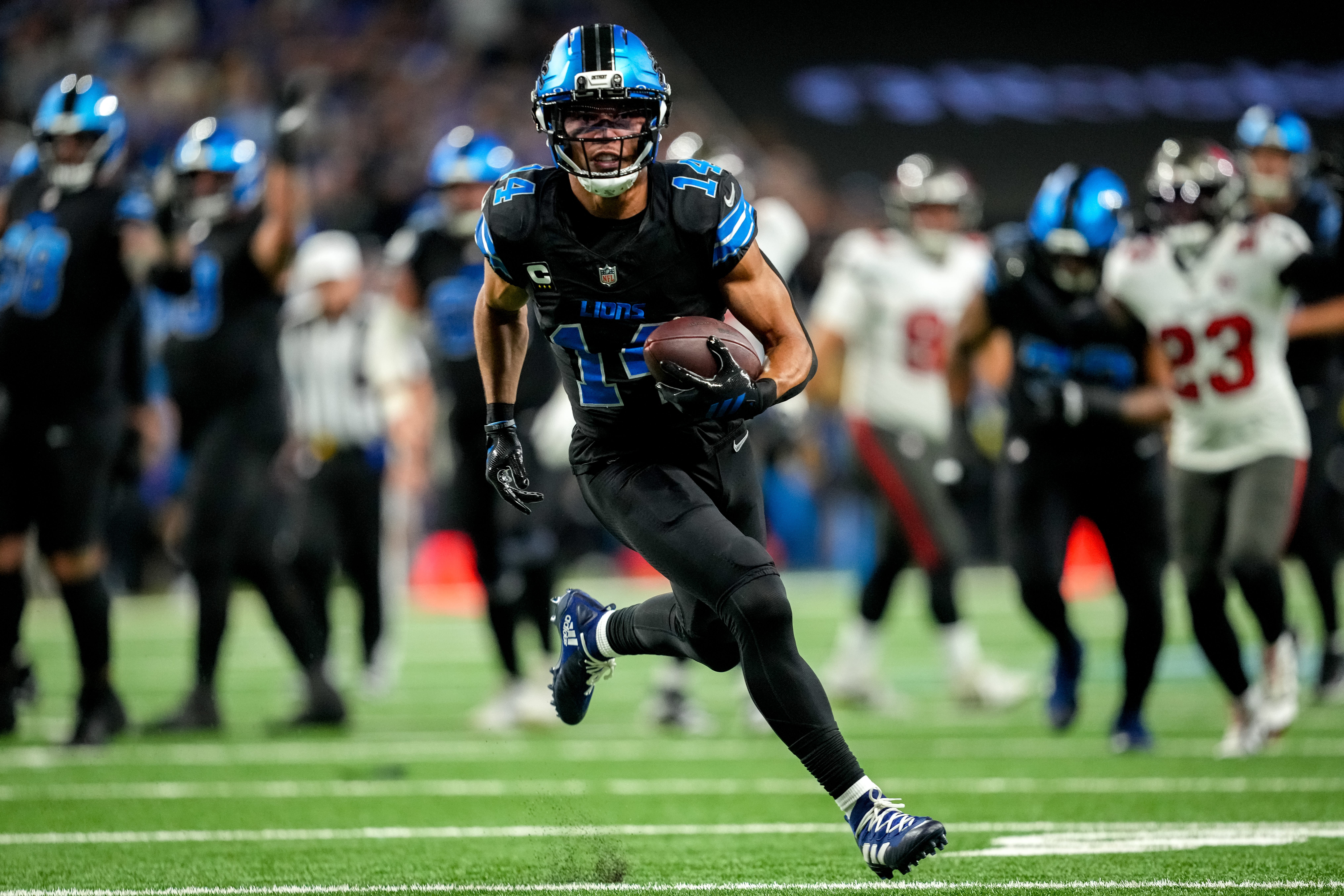 Amon-Ra St. Brown #14 of the Detroit Lions runs in action to score a touchdown in the first quarter against the Tampa Bay Buccaneers at Ford Field on October 20, 2025 in Detroit, Michigan.
