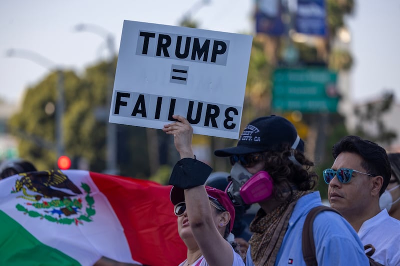 LOS ANGELES, CALIFORNIA - JUNE 12: People continue to protest in an approximately one-square mile area of downtown Los Angeles in response to a series of immigration raids on June 12, 2025 in Los Angeles, California. Protests escalated after President Donald Trump authorized military forces to protect federal property against the wishes of city and state officials who say that the Los Angeles police have the expertise and decades of experience to handle large protest crowds. National Guard troops have so far played no role in quelling violence in the streets, according to Mayor Bass, but are stationed to guard federal buildings.  (Photo by David McNew/Getty Images)