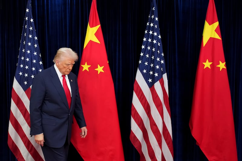 U.S. President Donald Trump prepares to greet Chinese President Xi Jinping ahead of a bilateral meeting at Gimhae Air Base on October 30, 2025 in Busan, South Korea.