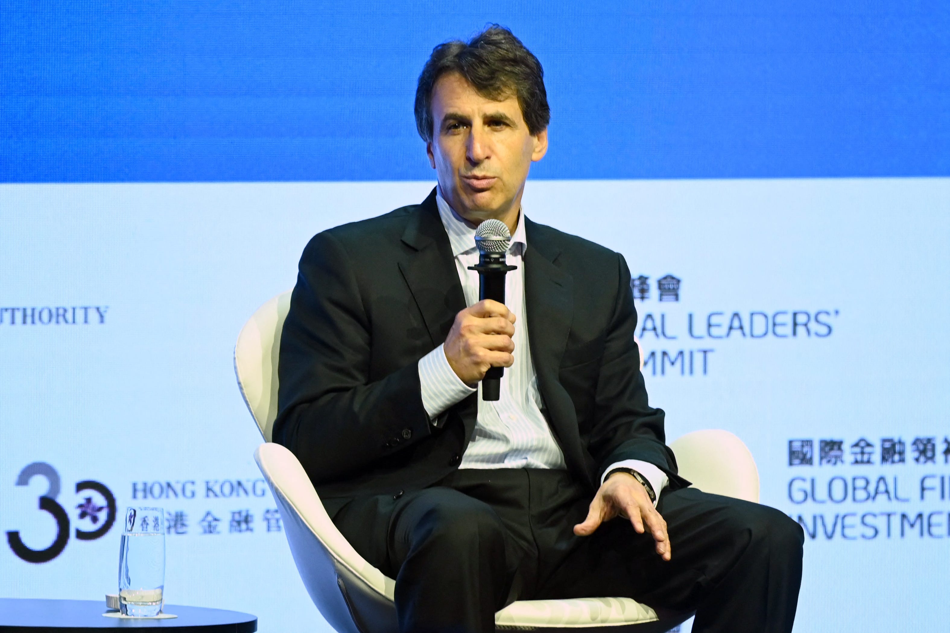 Marc Rowan speaks at a financial leaders' summit in Hong Kong.