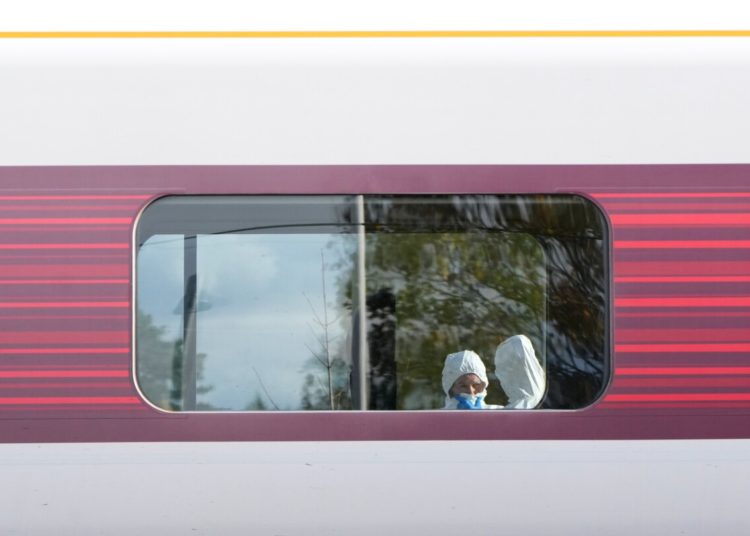 UK police charge man with attempted murder over train stabbing that wounded 11 people