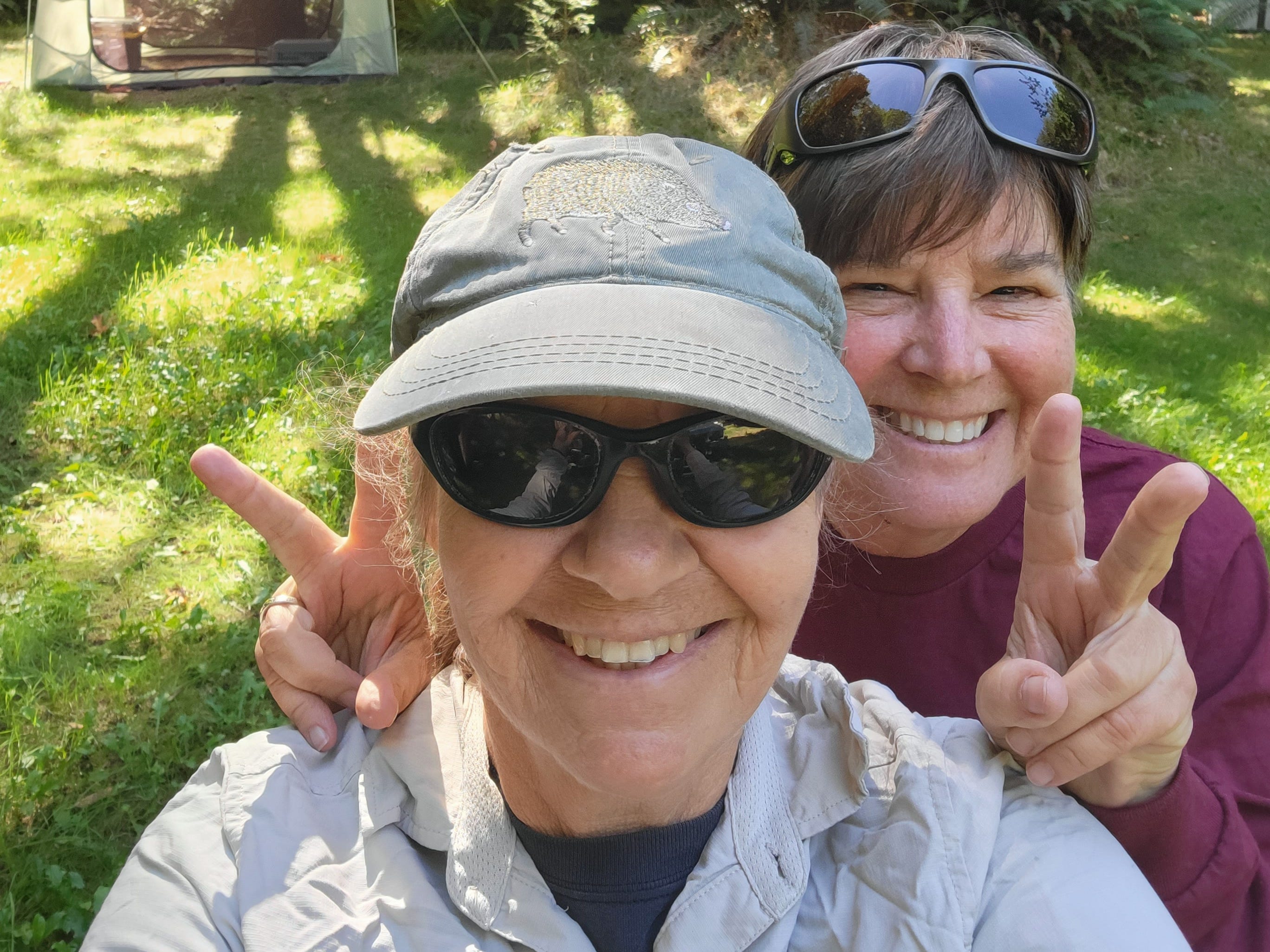 Author Sally Marks and Carol smiling with tent in background