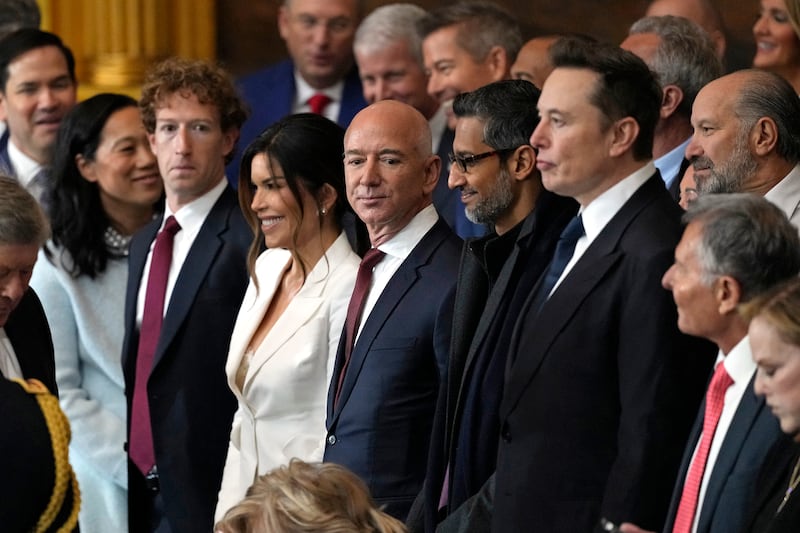 TOPSHOT - (L-R) CEO of Meta Mark Zuckerberg, Lauren Sanchez, US businessman Jeff Bezos, CEO of Alphabet Inc and Google Sundar Pichai and Teska and SpaceX CEO Elon Musk attend the inauguration ceremony where Donald Trump will sworn in as the 47th US President in the US Capitol Rotunda in Washington, DC, on January 20, 2025. (Photo by Julia Demaree Nikhinson / POOL / AFP) (Photo by JULIA DEMAREE NIKHINSON/POOL/AFP via Getty Images)
