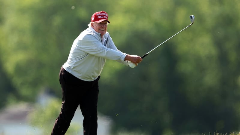 STERLING, VIRGINIA - MAY 25: Former President Donald Trump follows his second shot during the pro-am prior to the LIV Golf Invitational - DC at Trump National Golf Club on May 25, 2023 in Sterling, Virginia. (Photo by Rob Carr/Getty Images)