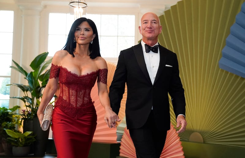Executive chairman of Amazon Jeff Bezos and Lauren Sanchez arrive for a State Dinner in honor of Japanese Prime Minister Fumio Kishida, at the Booksellers Room of the White House in Washington, DC, on April 10, 2024.