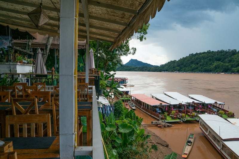 LUANG PRABANG, LAOS - AUGUST 8: Boats on the Mekong River in Luang Prabang as seen on August 8, 2025. Trump administration is set to introduce significant tariff adjustments, with Laos facing U.S. tariffs of 40% alongside stricter visa regulations. These measures are likely to further open the Lao market to increased influence from China, which already maintains a substantial presence in the country. (Photo by Magdalena Chodownik/Anadolu via Getty Images)