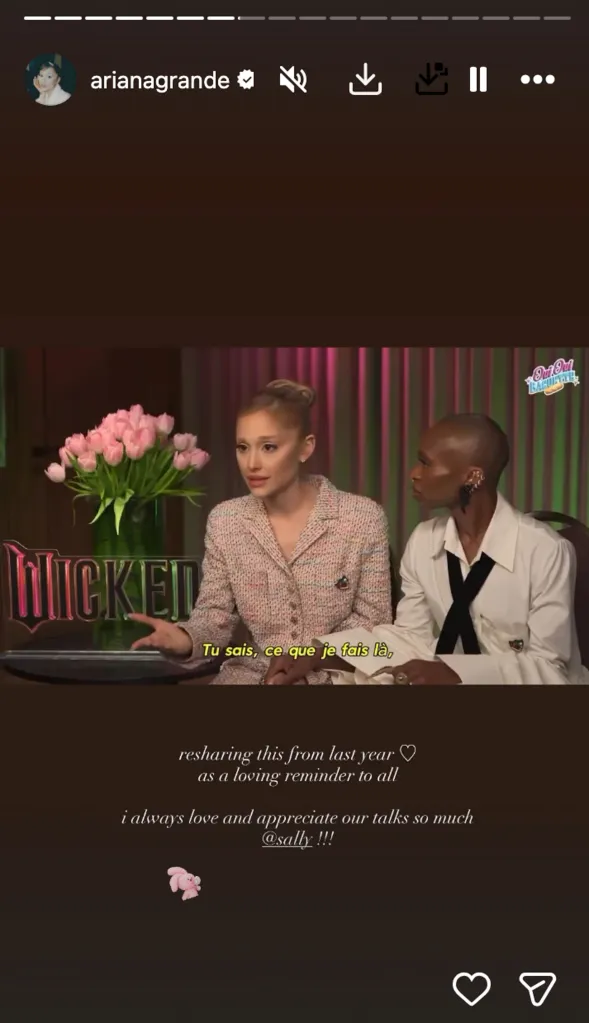 Ariana Grande and another person at a table with a