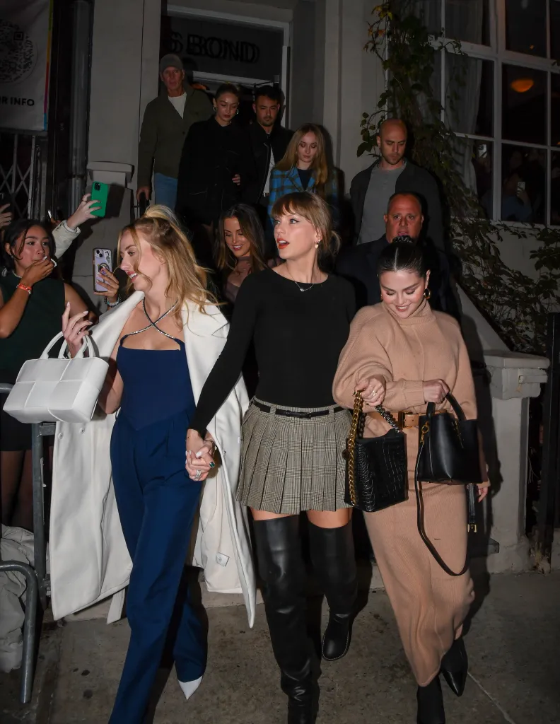 Brittany Mahomes, Taylor Swift, and Selena Gomez leaving a Japanese restaurant.