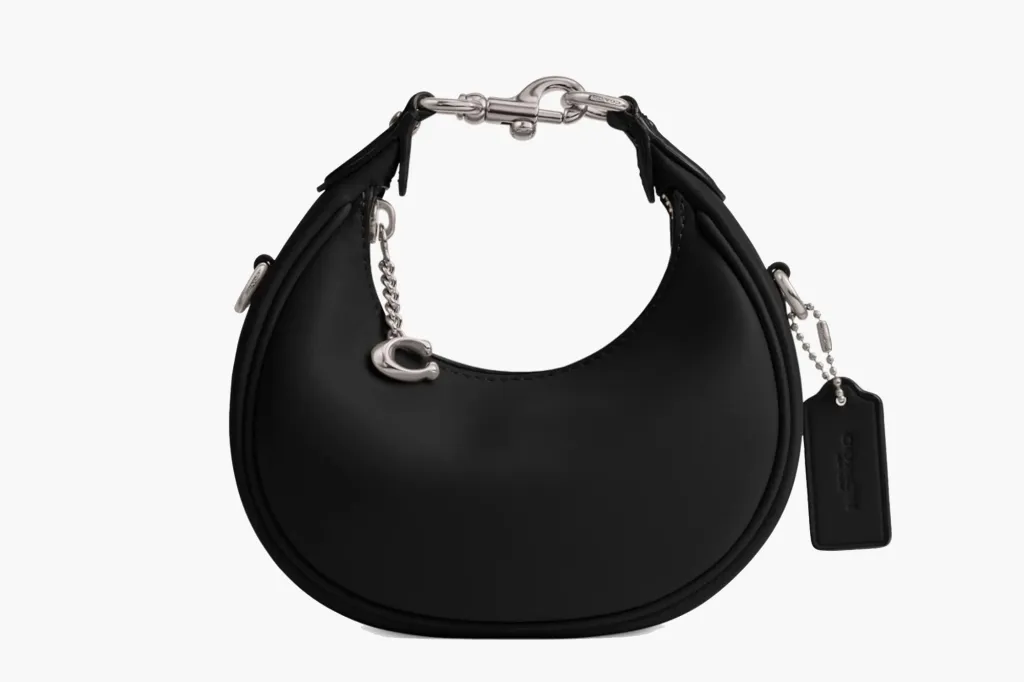 Coach black crescent shoulder bag with a silver chain and Coach 