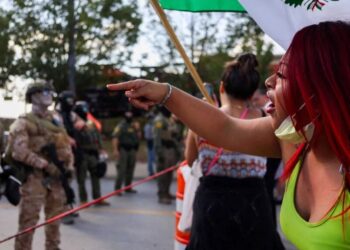 ‘We protect our own’: Chicago parents stand up to ICE despite threat of gas and violence