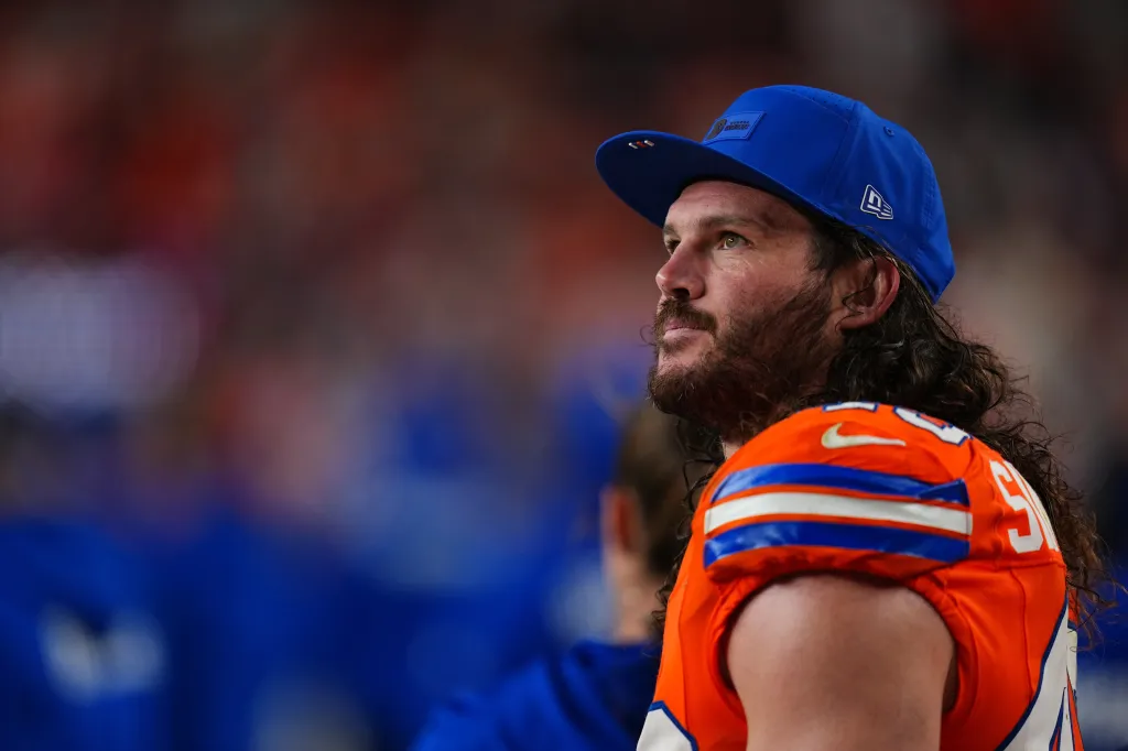 Broncos inside linebacker Alex Singleton watches from the sidelines during the second half of an NFL football game against the Las Vegas Raiders Thursday, Nov. 6, 2025, in Denver. 