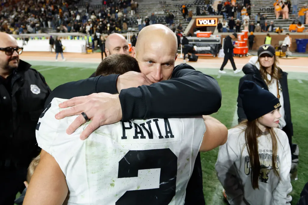 Vanderbilt Head Coach Clark Lea hugs quarterback Diego Pavia after the team's win.