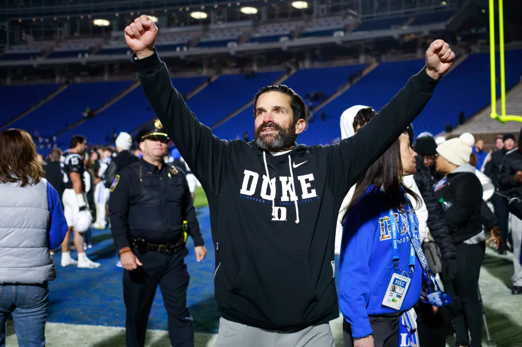 Duke head coach Manny Diaz celebrates his team's victory.