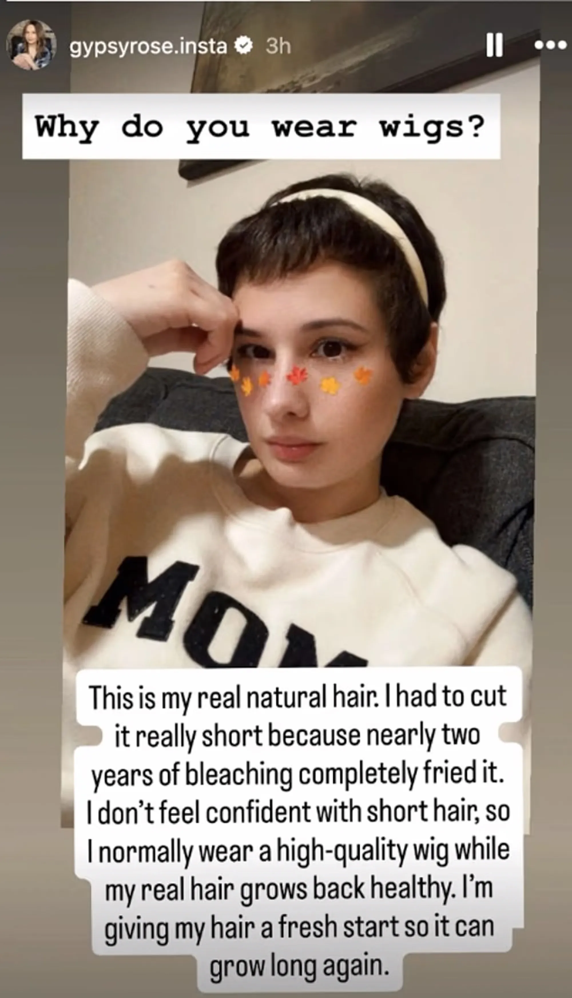 Gypsy Rose Blanchard with short, natural hair, wearing a white headband and a light sweatshirt with 