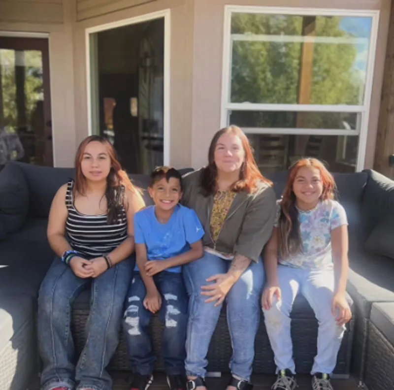 The Corado family: Mia, Toretto, and MaKenlee with an adult woman.