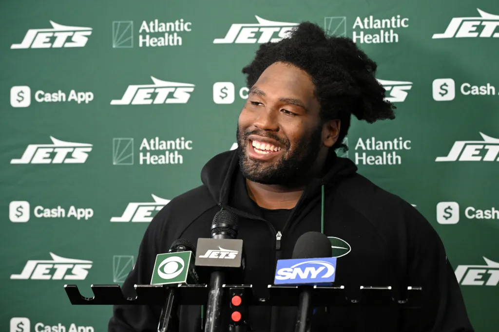 Jets defensive tackle Jowon Briggs speaking to the media at a press conference.