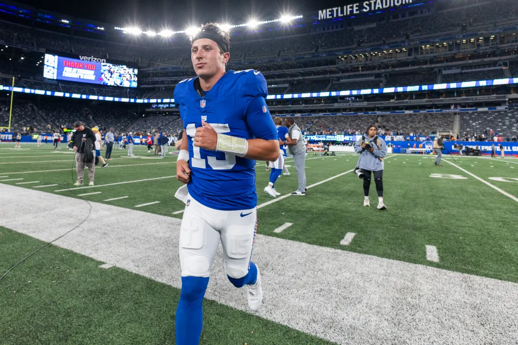 New York Giants quarterback Tommy DeVito (15) jogs off the field at MetLife Stadium.