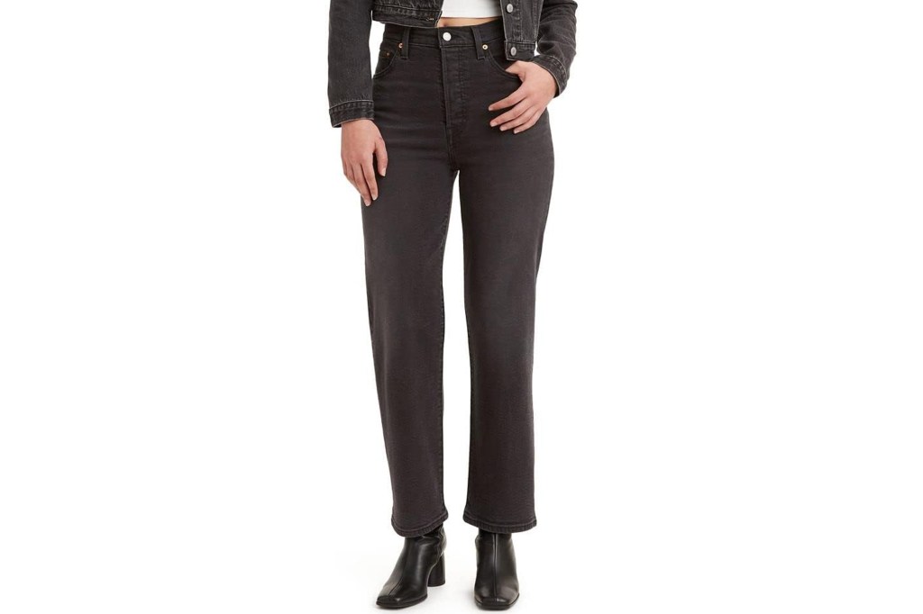 Person wearing Levi's jeans and a denim jacket.