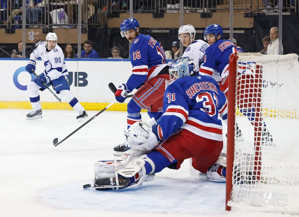 Rangers goaltender Igor Shesterkin (31) makes a save on a shot by Tampa Bay Lightning defenseman J.J. Moser.