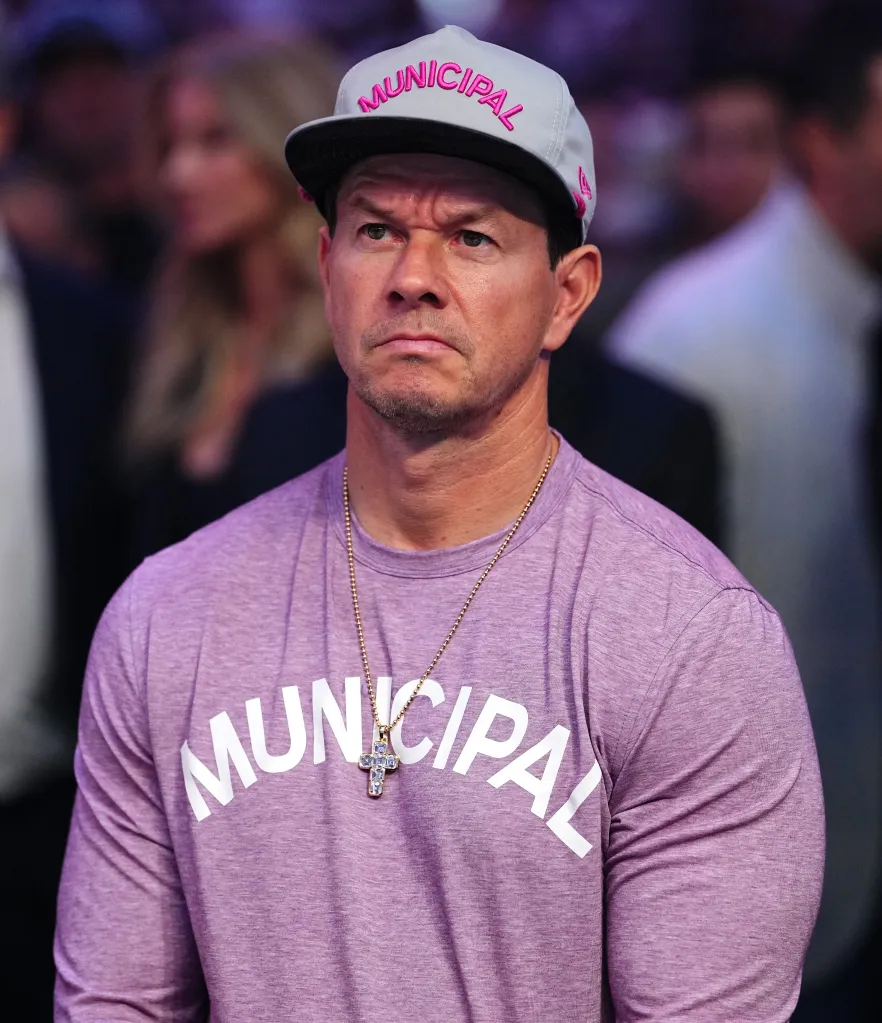 Mark Wahlberg wearing a gray baseball cap with 
