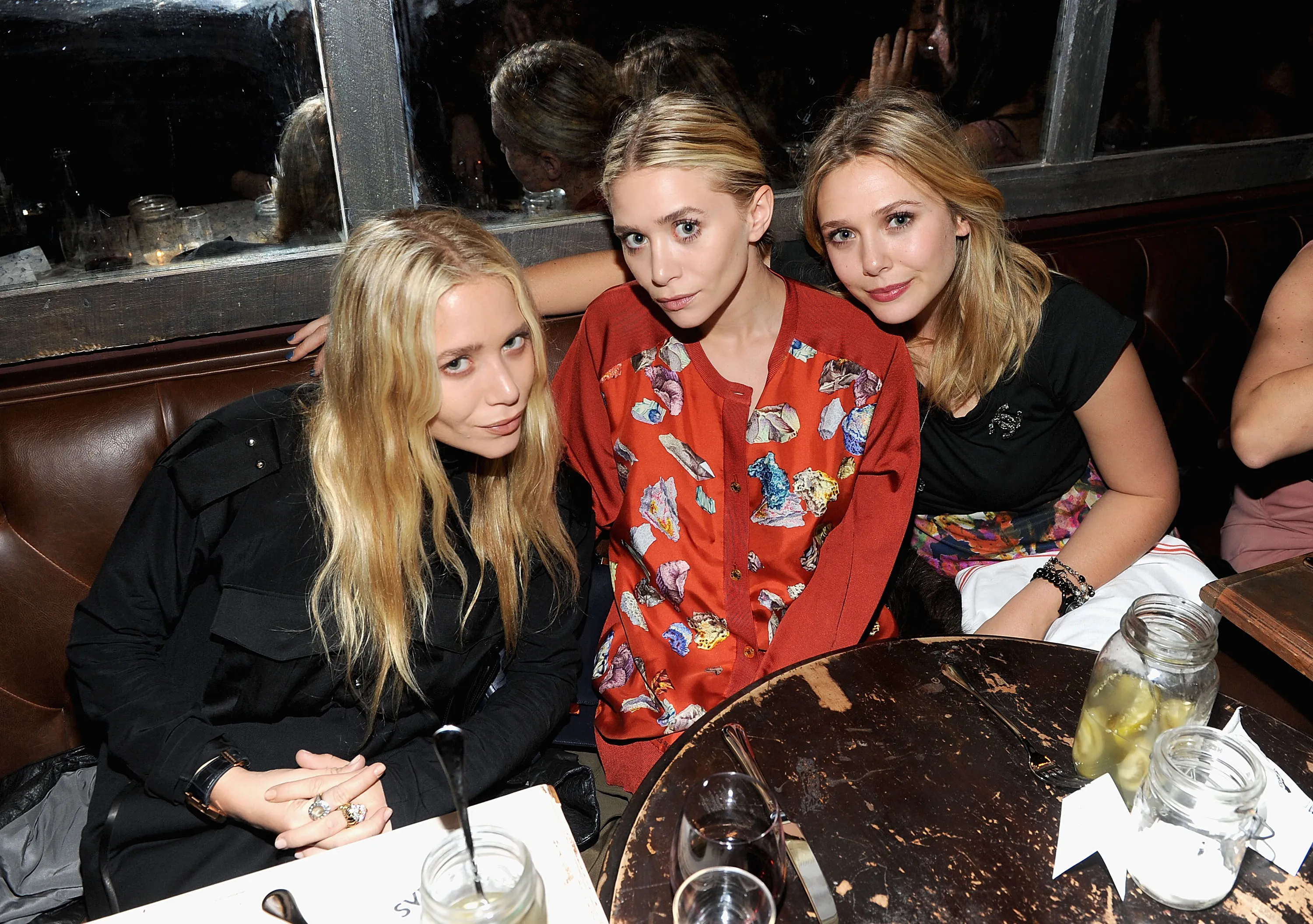 Mary-Kate Olsen, Ashley Olsen, and Elizabeth Olsen attend the NYLON & AX Armani Exchange Private Dinner.