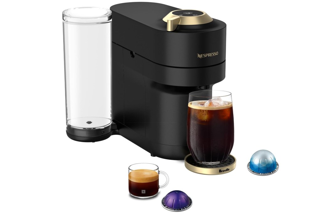 A Nespresso Vertuo coffee machine by Breville, with an iced coffee and an espresso, and two Nespresso pods.