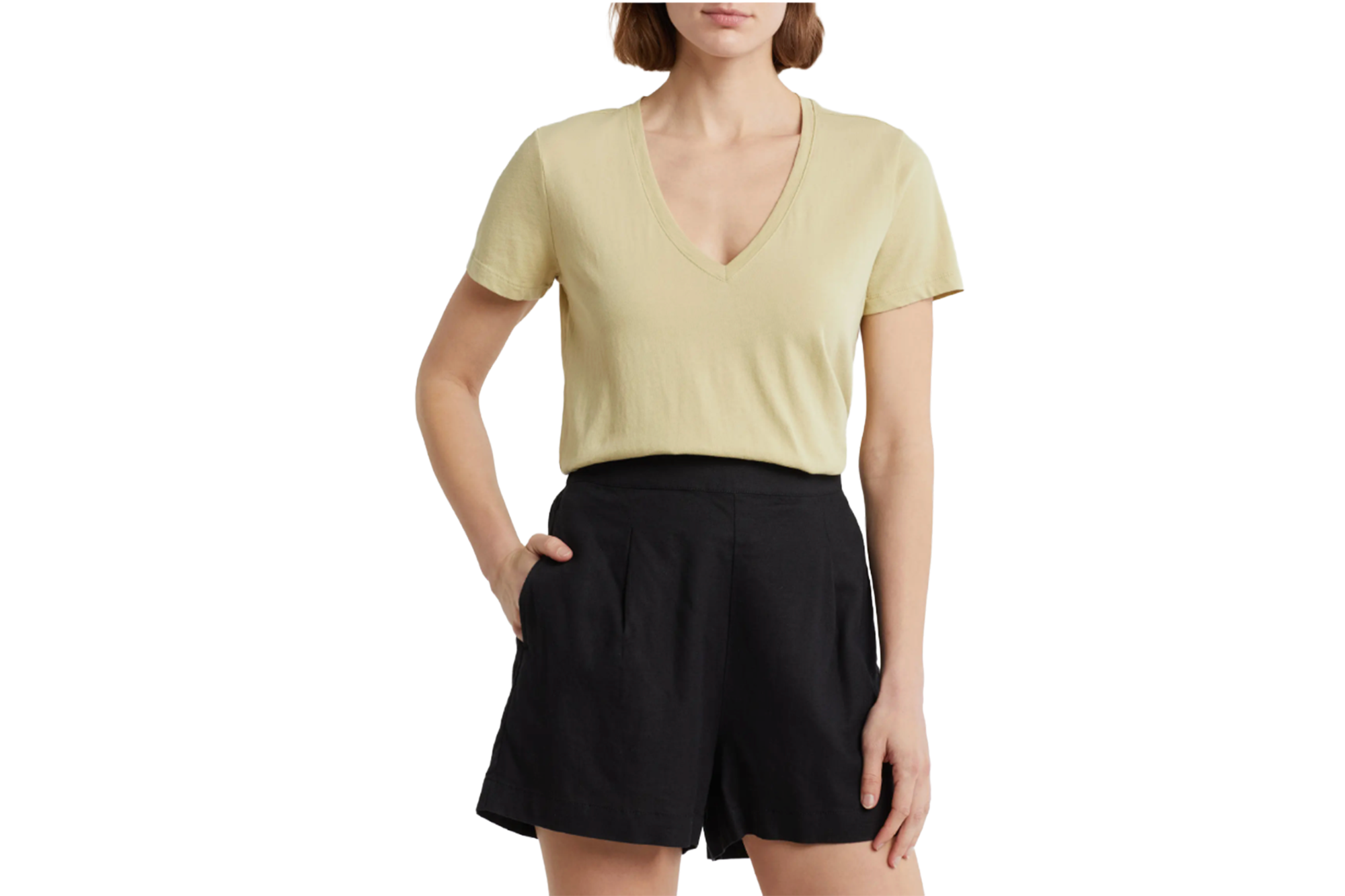 Model wearing a light yellow v-neck short-sleeved top and black shorts.