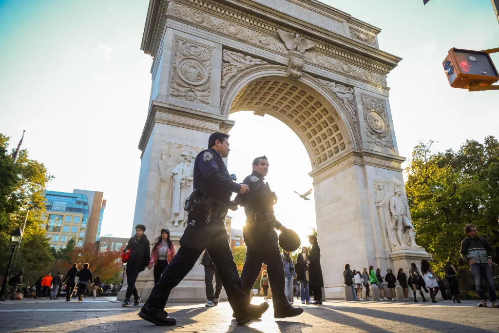 NYPD officers patrolling Washington Square Park during a recent crackdown on open-air drug use on Nov. 1, 2025.