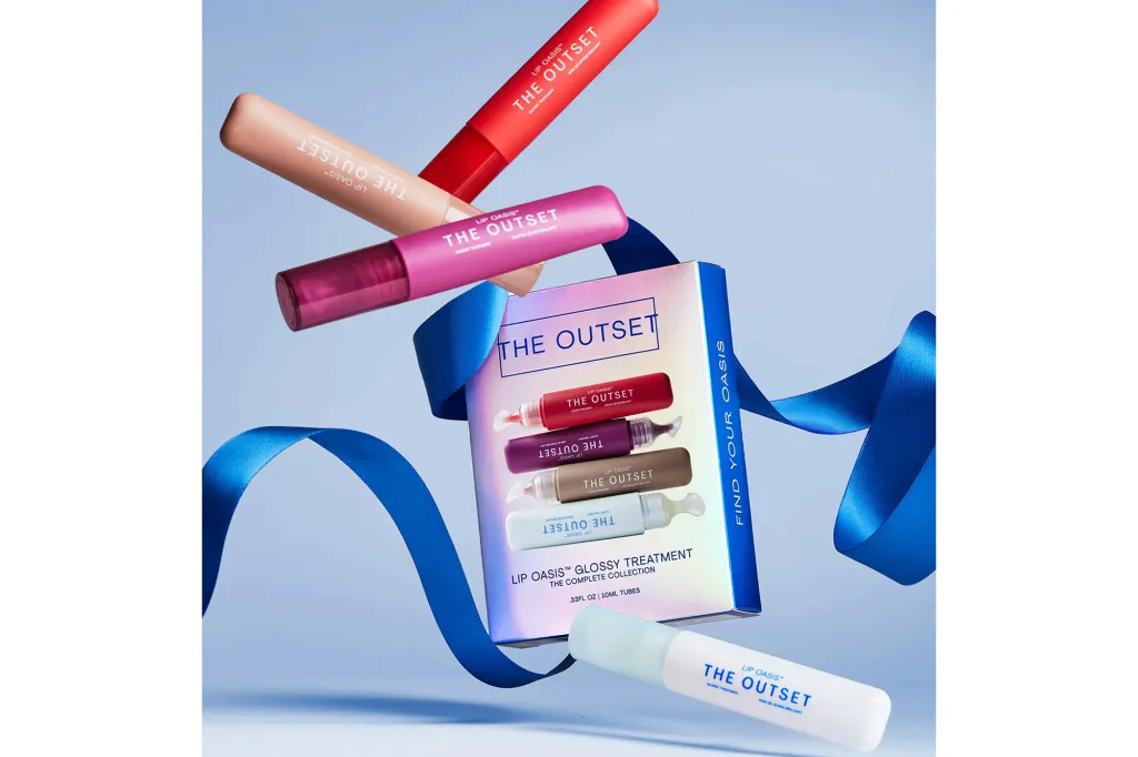 The Outset Lip Oasis Glossy Treatment set with individual lip glosses in various colors.