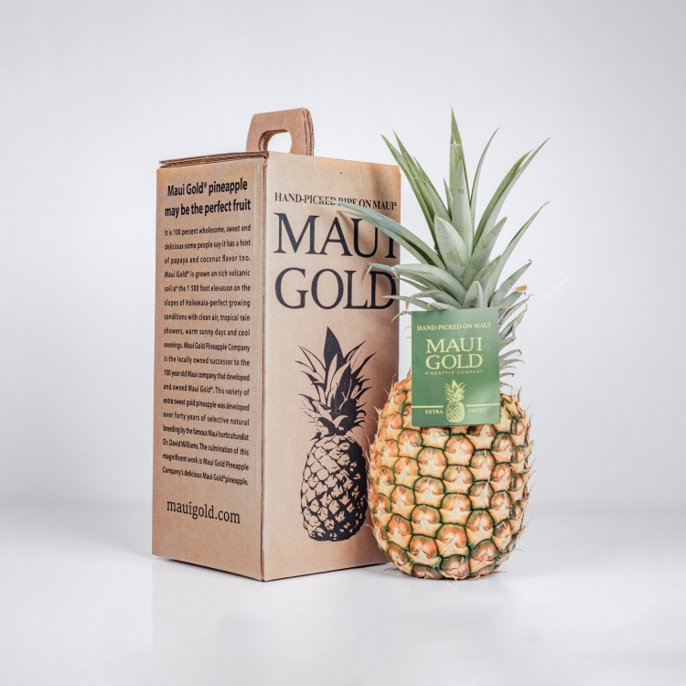 A Maui Gold pineapple and the brown box it comes in. 