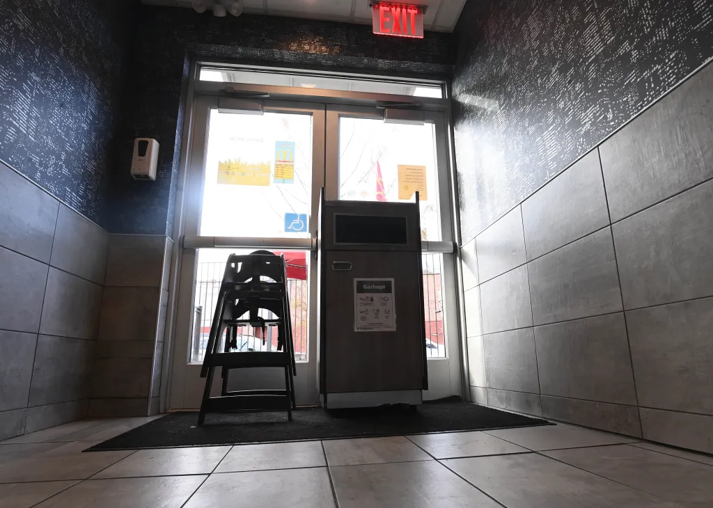 McDonald's with the door barricaded from the inside with a garbage can and high chairs