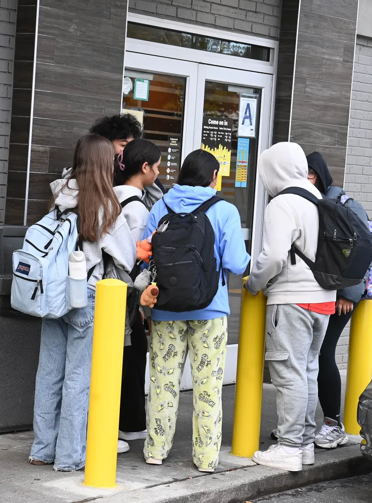 teens standing outside the mcdonald's unable to enter