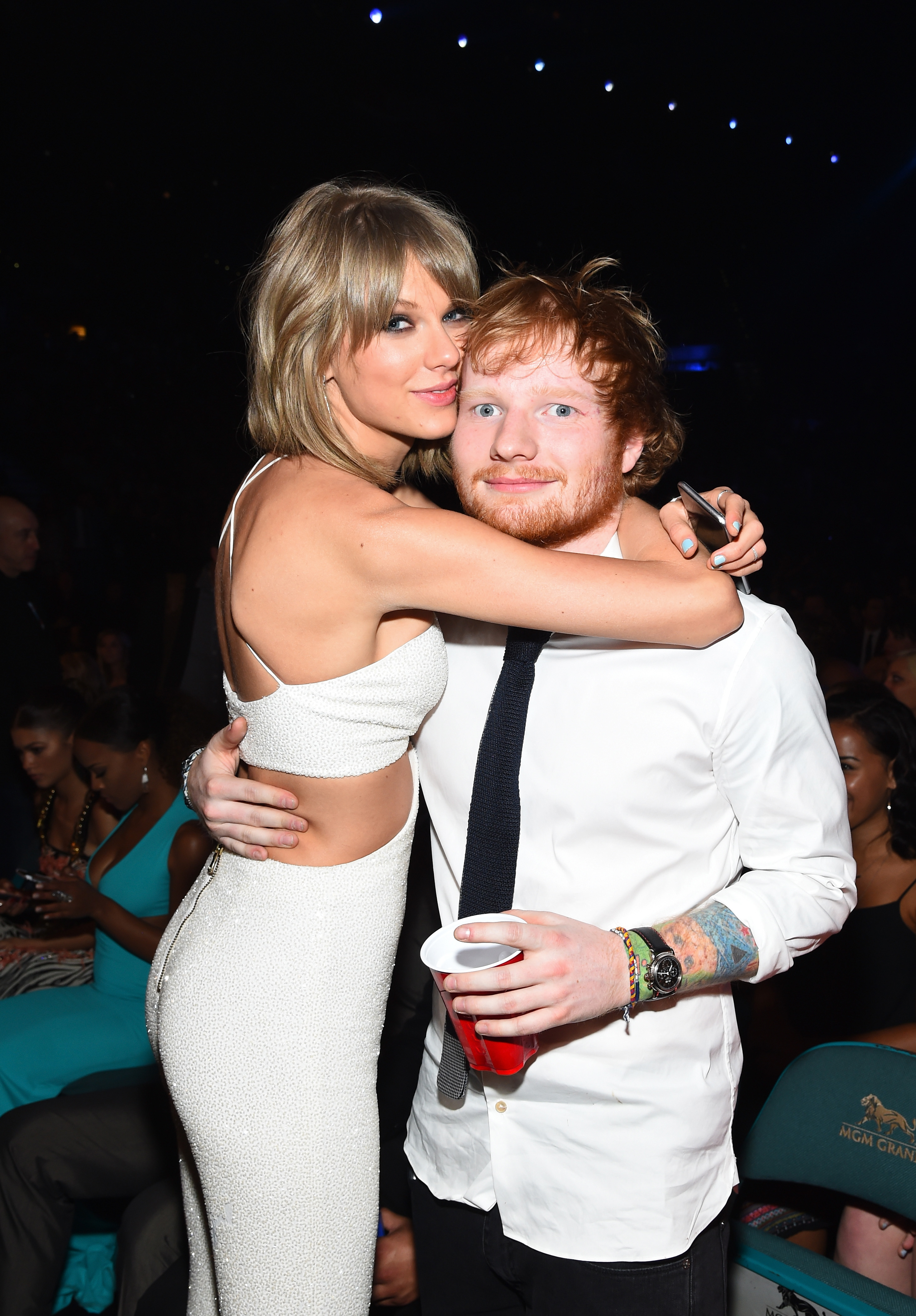 Taylor Swift and Ed Sheeran hugging at the 2015 Billboard Music Awards.