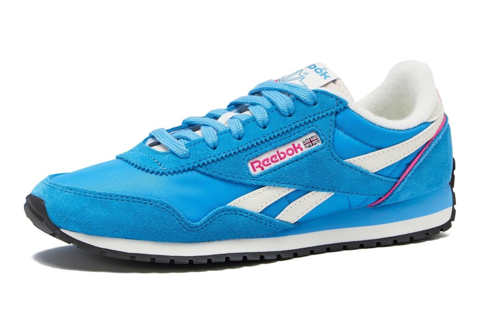 Blue Reebok Classic Nylon sneakers with white stripes and a pink accent.
