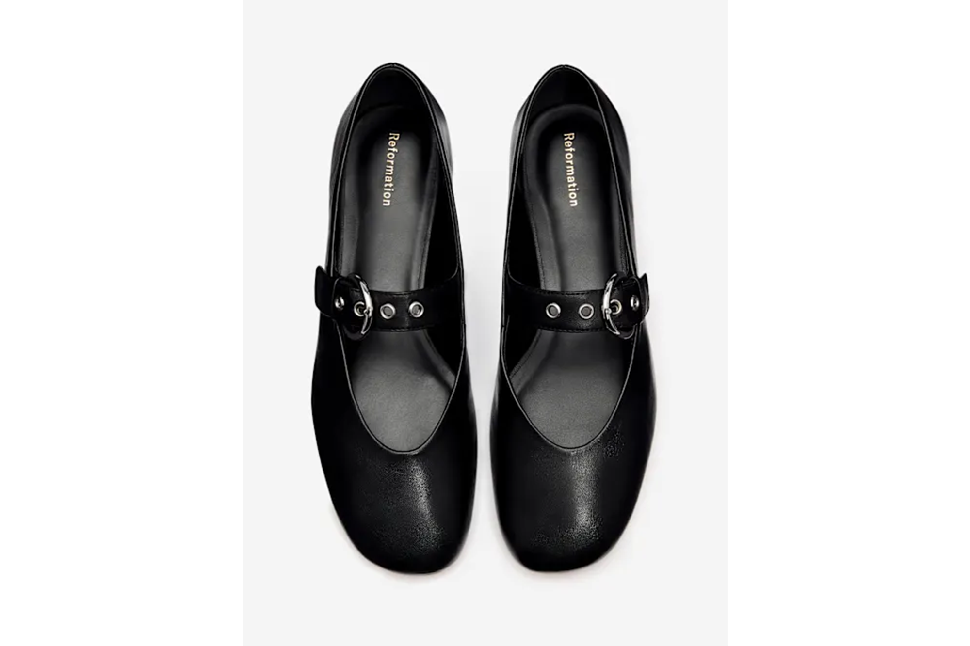 Pair of black Reformation Mary Jane shoes with silver buckles.