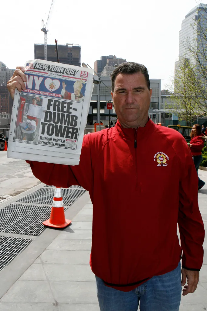 Retired FDNY Deputy Chief Jim Riches holds up a 